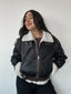 Chaqueta negra café tipo cazadora para mujer con chiporro, cinturón y cuello alto kadenkas.com