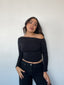 Polera negra off-shoulder para mujer, ajustada, elasticada, manga larga y cómoda kadenkas.com